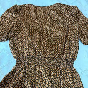 Black and copper cinch waist blouse